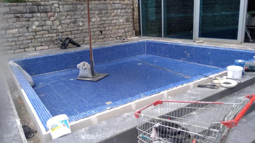 a pool being built with a mop on top of it at Georgijevic 2 in Budva