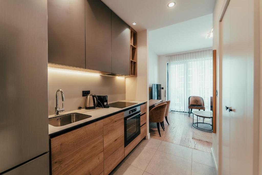 a kitchen with a sink and a counter top at BW Symphony Suites in Belgrade