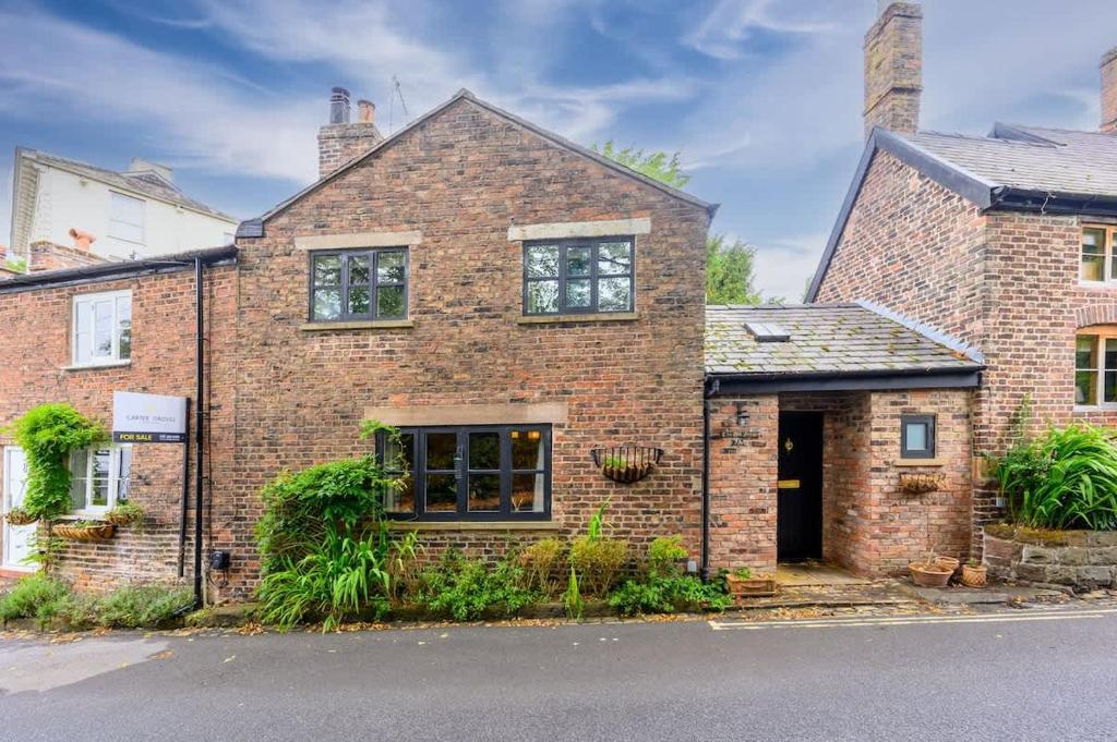 an old brick house with at Stunning Bowdon Cottage by City SuperHost in Bowdon