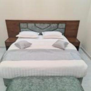 En eller flere senge i et værelse på يمامه الفخامه للشقق الفندقيه