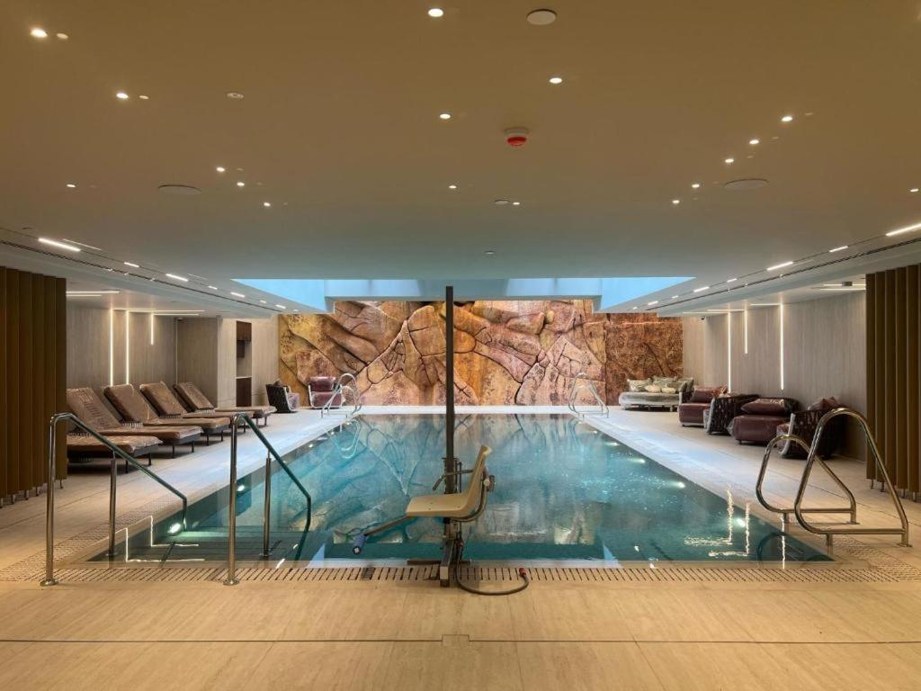 a large swimming pool in a hotel room at אלמה דירות נופש U360-m in Eilat