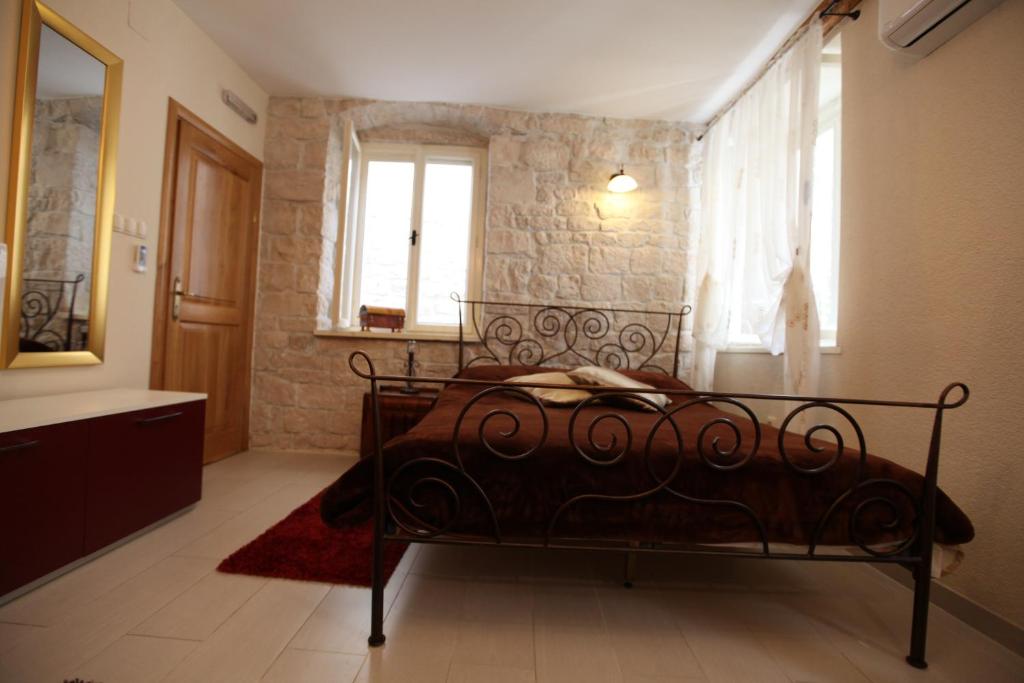 Posteľ alebo postele v izbe v ubytovaní Tragurium & Salona Apartments