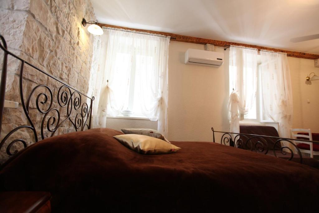 Posteľ alebo postele v izbe v ubytovaní Tragurium & Salona Apartments