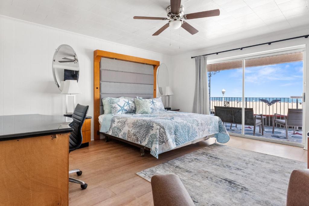 a bedroom with a bed and a view of the ocean at 2 Bed1 Bath on the Boardwalk by the Inlet in Ocean City