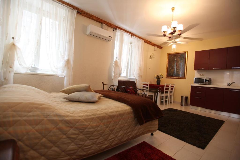 Posteľ alebo postele v izbe v ubytovaní Tragurium & Salona Apartments