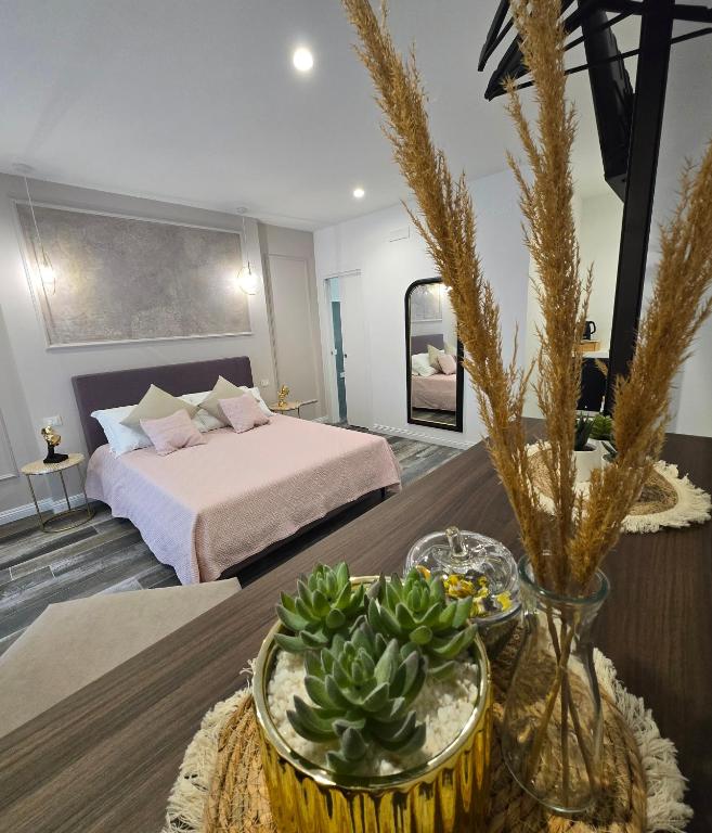 a hotel room with a bed and a table at Ni-lù Room's in Campomarino