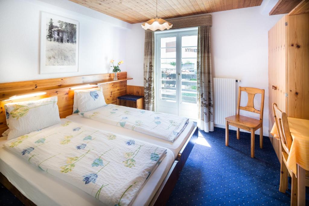 Postel nebo postele na pokoji v ubytování Hotel Alpina
