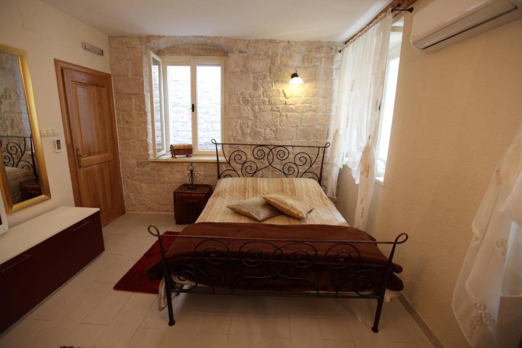 Posteľ alebo postele v izbe v ubytovaní Tragurium & Salona Apartments