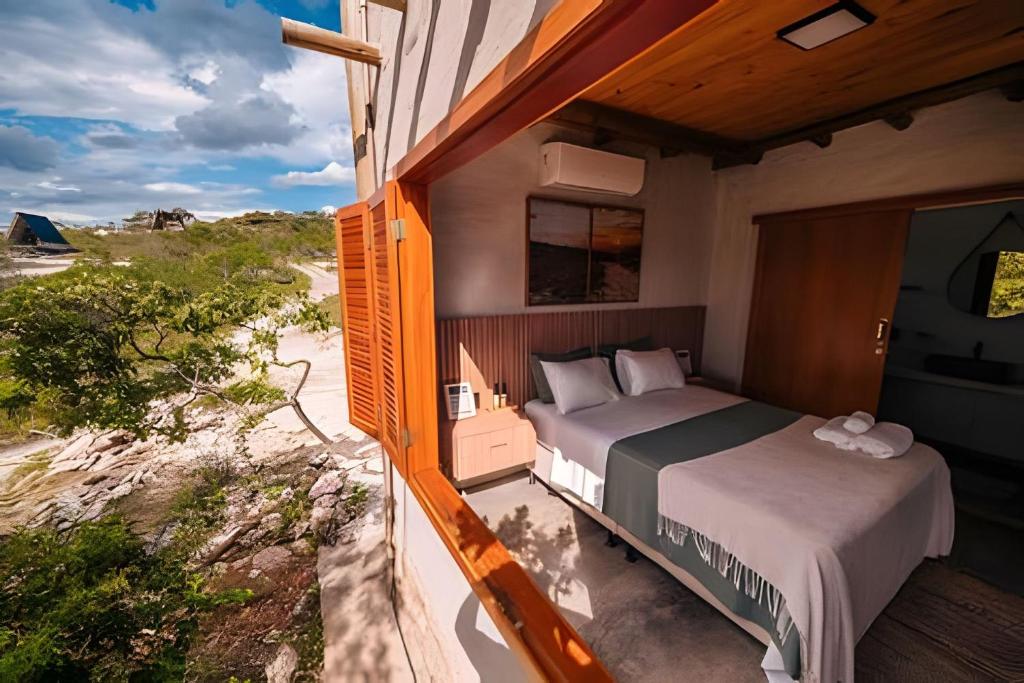 Katil atau katil-katil dalam bilik di Cabanas do Ouro - O seu refúgio dos sonhos em Pirenópolis