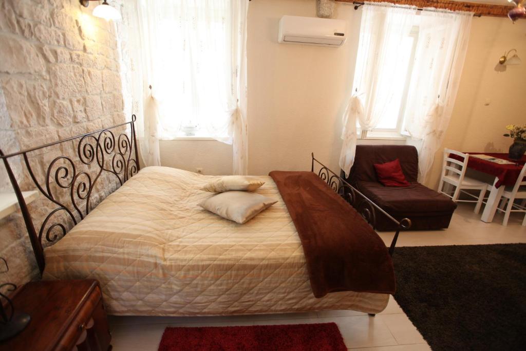 Posteľ alebo postele v izbe v ubytovaní Tragurium & Salona Apartments