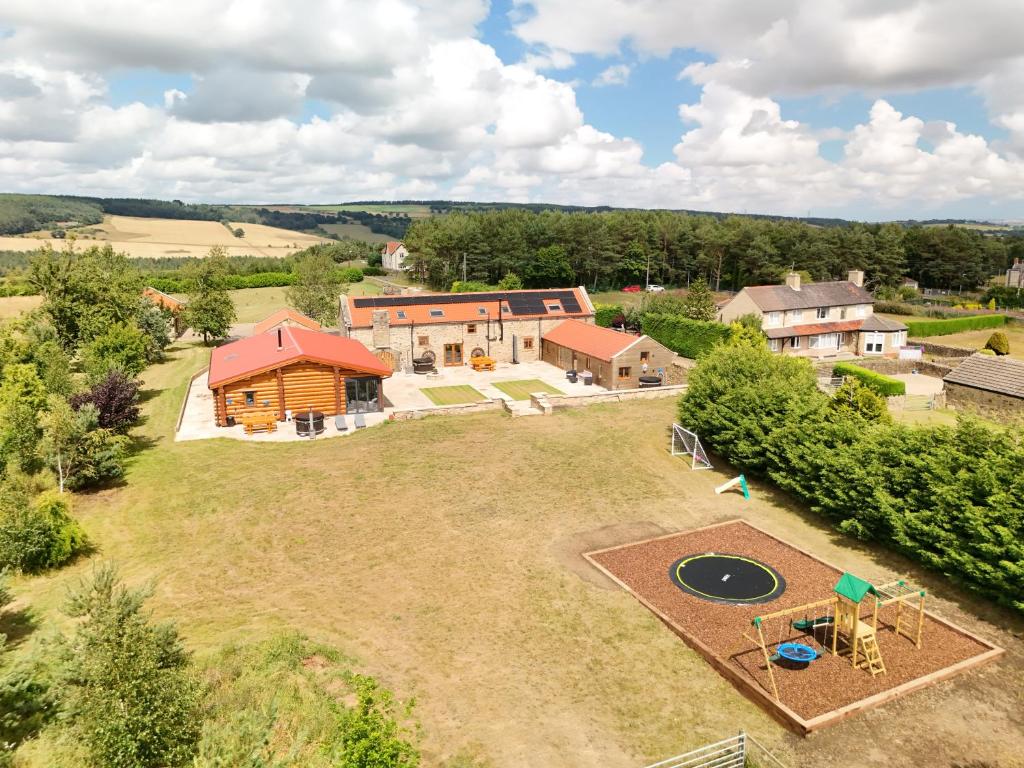 an aerial view of a house with a frisbee at The Estate, Luxury Spacious Family Stay with 3 Hot Tubs, Scenic Views Sleeps 16 near Durham & Bishop Auckland in Durham