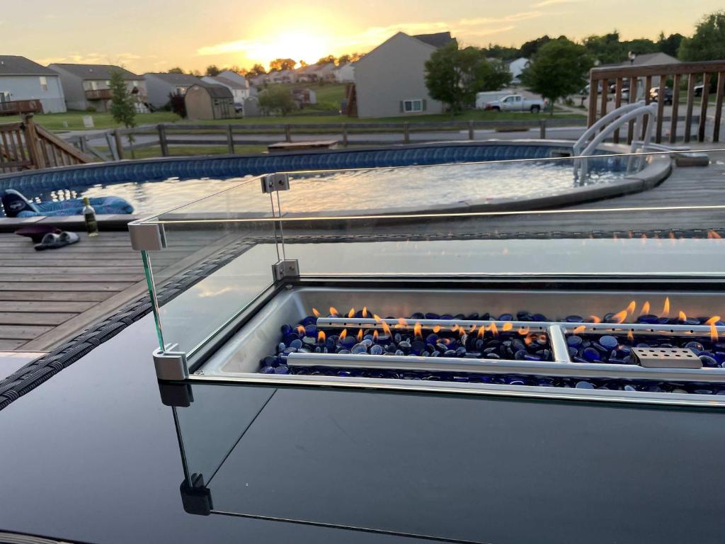 a pool with a fire pit in the water at The Gem Vacation Rental in Walton