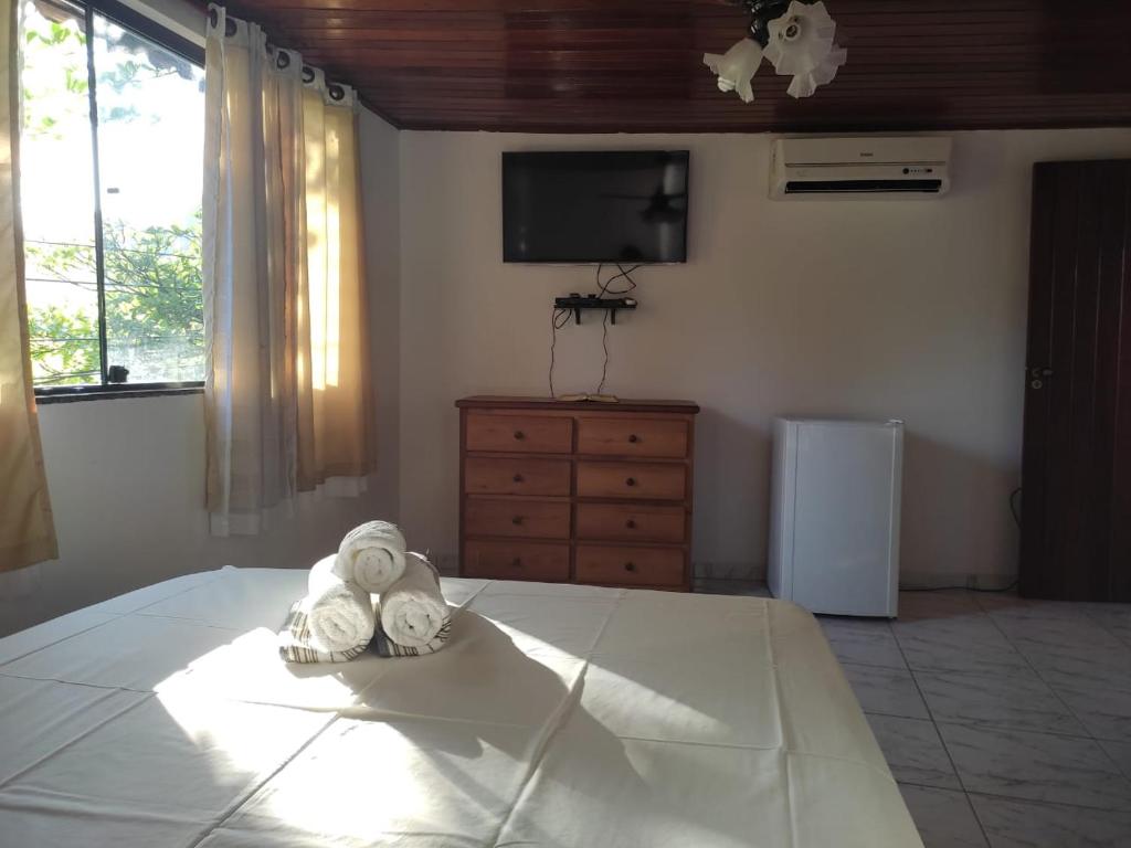 TV a/nebo společenská místnost v ubytování Suites Rei da Moqueca