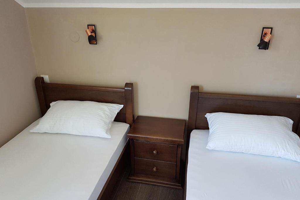 Postel nebo postele na pokoji v ubytování Apartmani Simić Valjevo