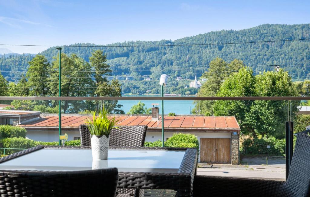 a view from the balcony of a house with a table and chairs at Ferienwohnung Pörtschach in Pörtschach am Wörthersee