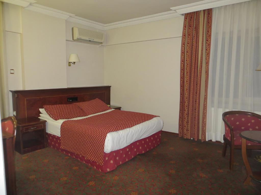 Postel nebo postele na pokoji v ubytování Ozilhan Hotel