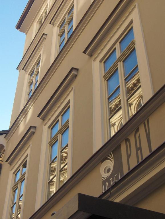 a building with windows on the side of it at Hotel Páv in Prague