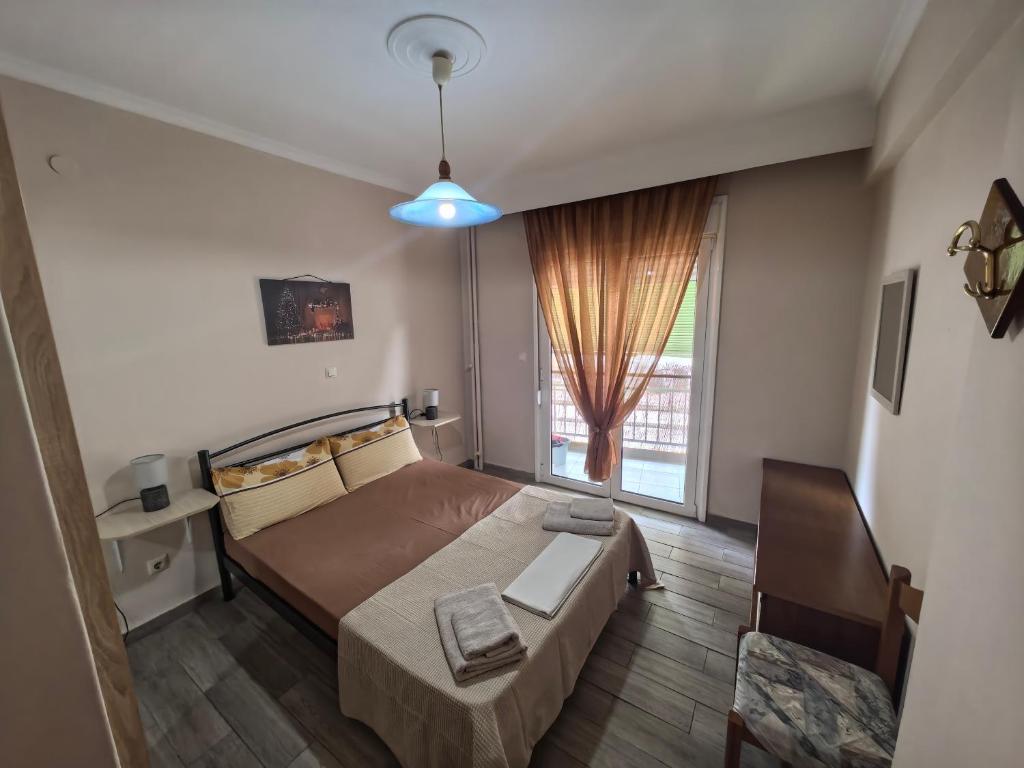 Ένα ή περισσότερα κρεβάτια σε δωμάτιο στο Artemis sweet apartment
