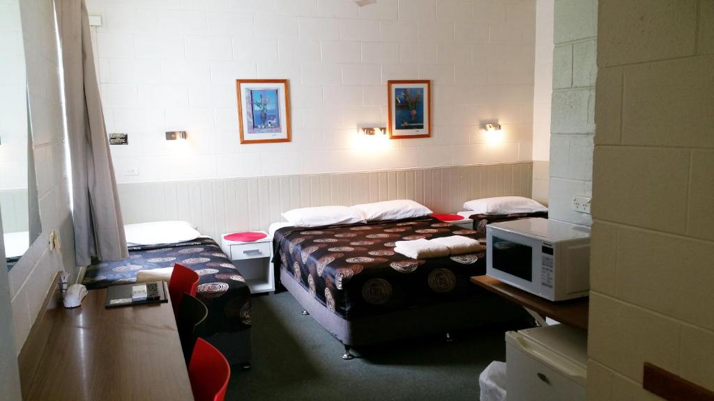 Postel nebo postele na pokoji v ubytování A&A Lodge Motel