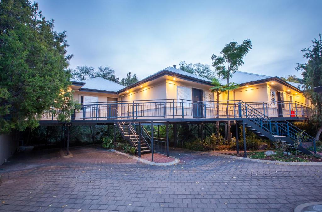 a house with a staircase in front of it at The Mill Apartments Clare Valley in Clare