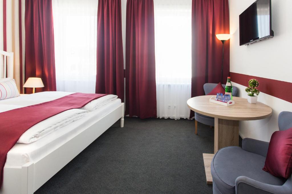 Postel nebo postele na pokoji v ubytování Hotel Condor