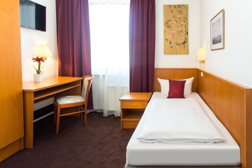 Postel nebo postele na pokoji v ubytování Hotel Condor