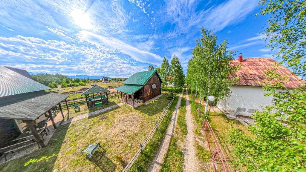 an overhead view of a farm with a barn at Cozy Wooden House with Fireplace near Zabljak & Durmitor in Žabljak
