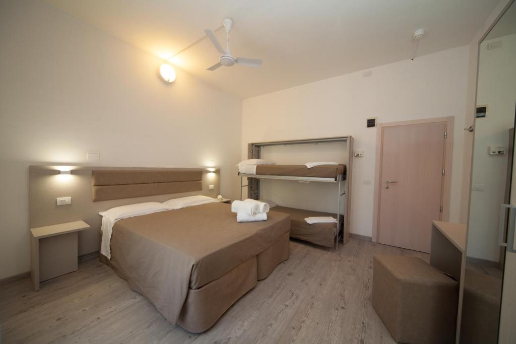 Postel nebo postele na pokoji v ubytování Hotel Lux