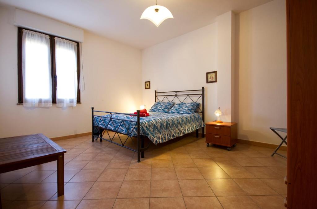 Łóżko lub łóżka w pokoju w obiekcie Elena House Fertilia