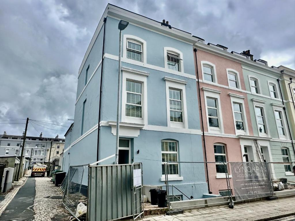 a blue building on the side of a street at Eden on the Hoe in Plymouth