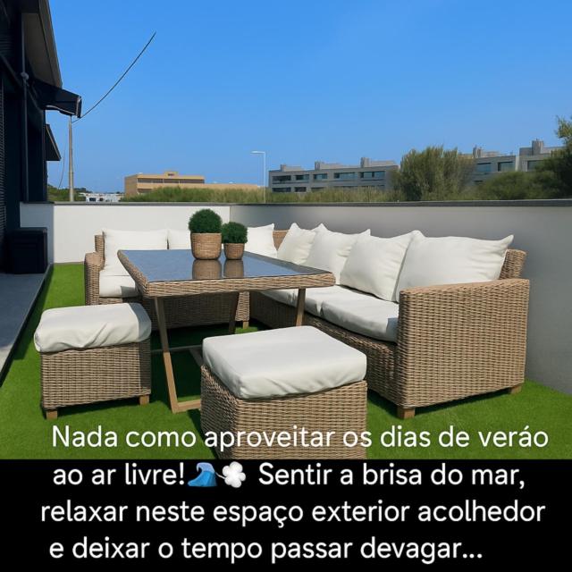 a patio with a couch and a table and chairs at Apuliaapartments in Apúlia