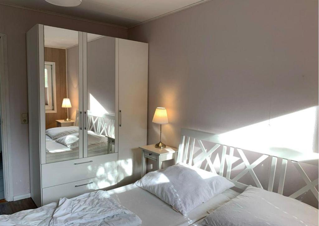 Ένα ή περισσότερα κρεβάτια σε δωμάτιο στο Ferienwohnung-in-Strandnaehe-Schwalbennest-2