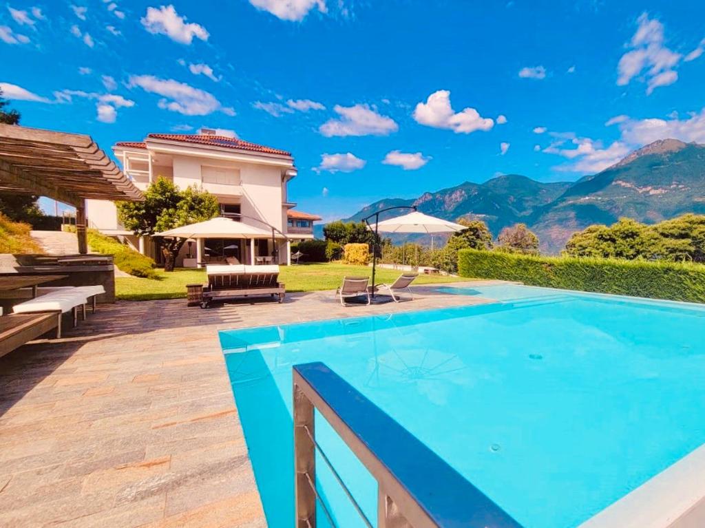 a swimming pool in the backyard of a villa at Villa Panoramica in Artogne