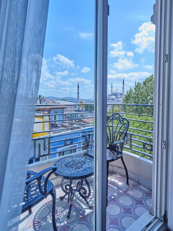 a balcony with a chair and a view of the city at Four-G Hotel Premium in Istanbul