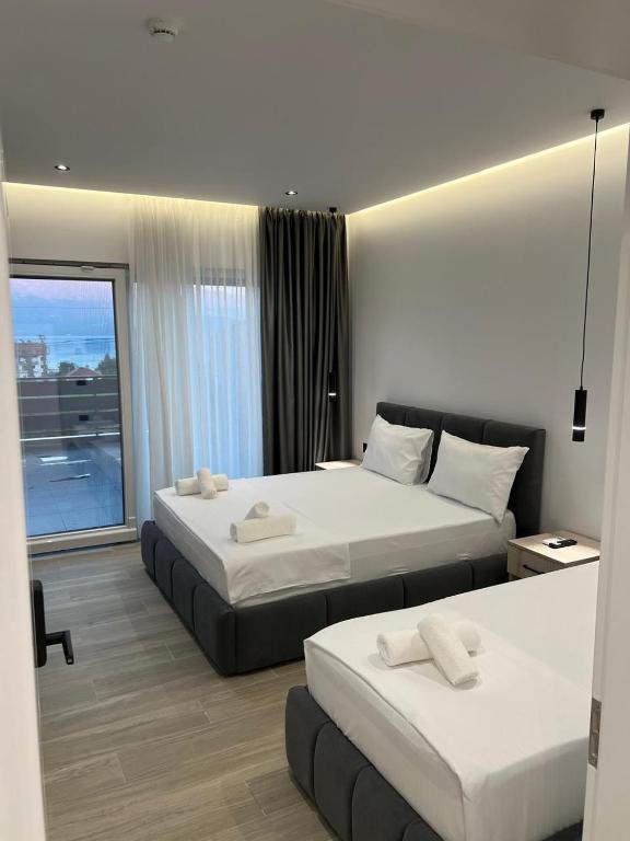Postel nebo postele na pokoji v ubytování Hotel Restorant Binjaket