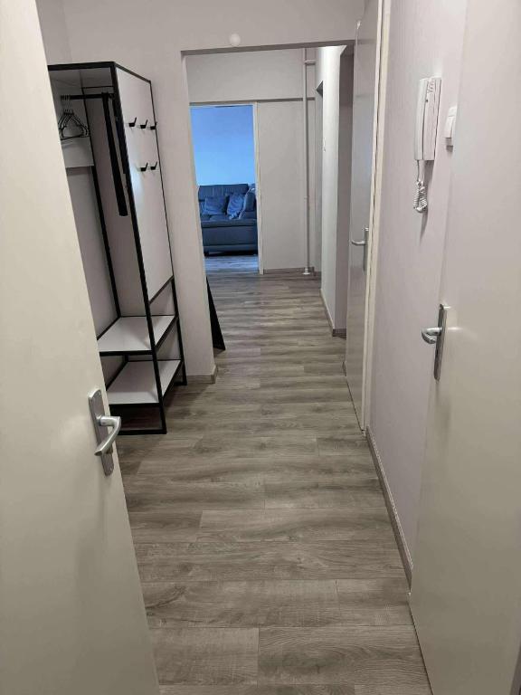 a corridor of an empty room with a long hallway at MiDo in Zalaegerszeg