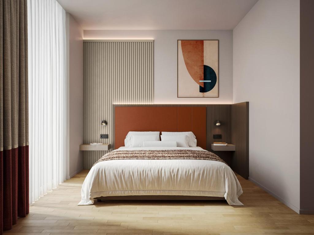 Ένα ή περισσότερα κρεβάτια σε δωμάτιο στο Mokinba Hotels Baviera