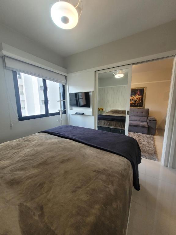 Кровать или кровати в номере Flat Hotel Jardins Alameda Lorena Com Garagem 1804