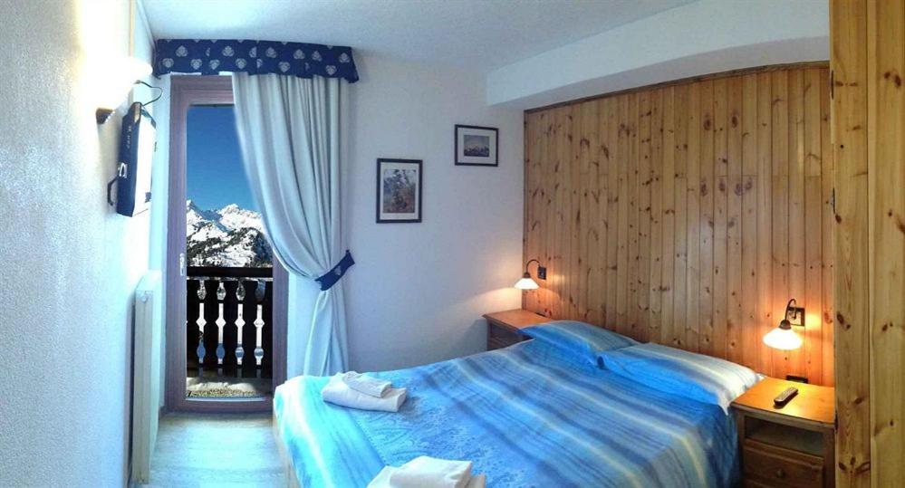 Postel nebo postele na pokoji v ubytování Rifugio Orso Bruno