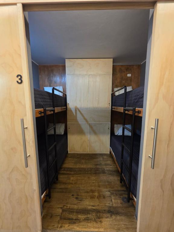 a hallway with two bunk beds in a room at sabina nuevo aeropuerto x12 in Lima
