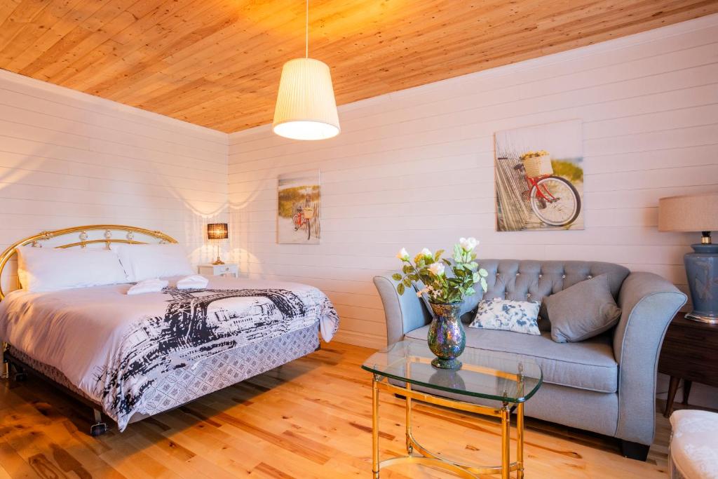 Ένα ή περισσότερα κρεβάτια σε δωμάτιο στο Auberge Évasion Nature Petite-Vallée