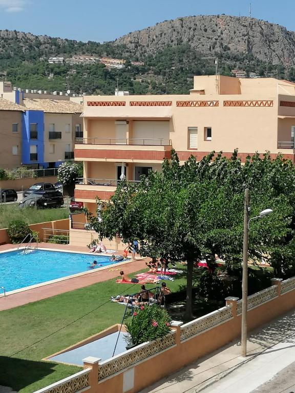 a resort with a swimming pool and a building at Apartaments Fincasol in L'Estartit