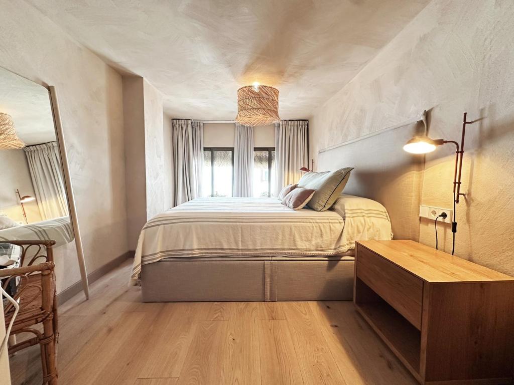 a bedroom with a bed and a window at Casa Altea Casco Antiguo in Altea