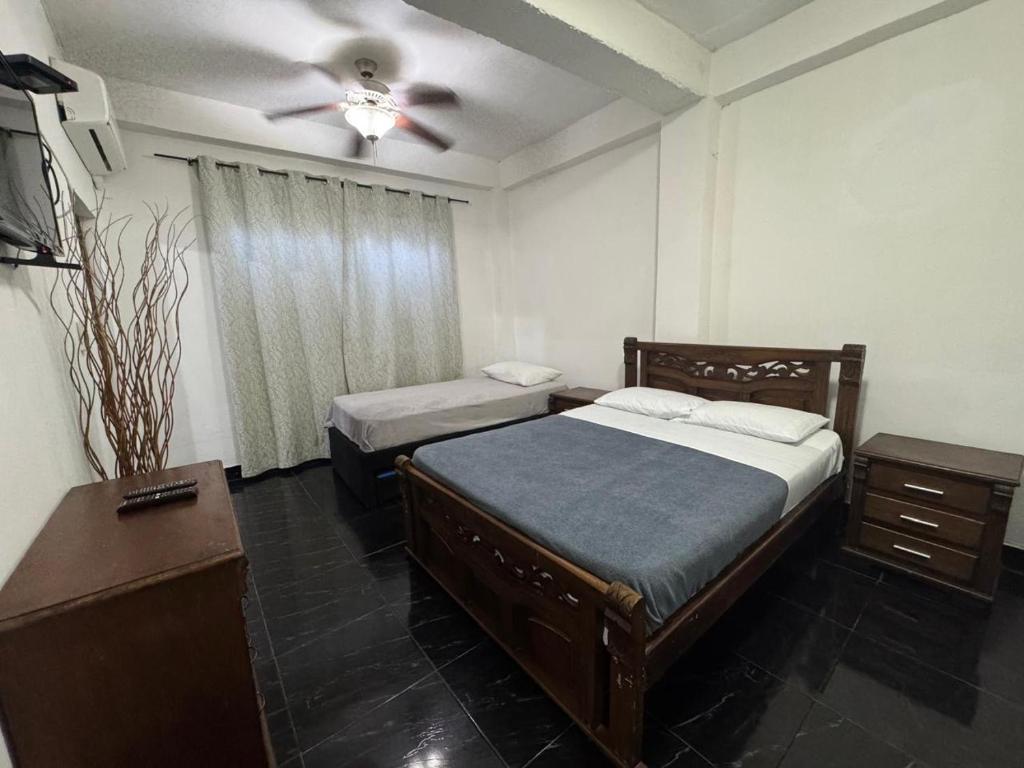 Postel nebo postele na pokoji v ubytování Apartamentos Central City