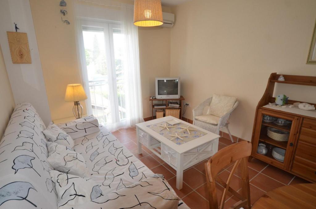 Televízia a/alebo spoločenská miestnosť v ubytovaní Apartment Anna Borik