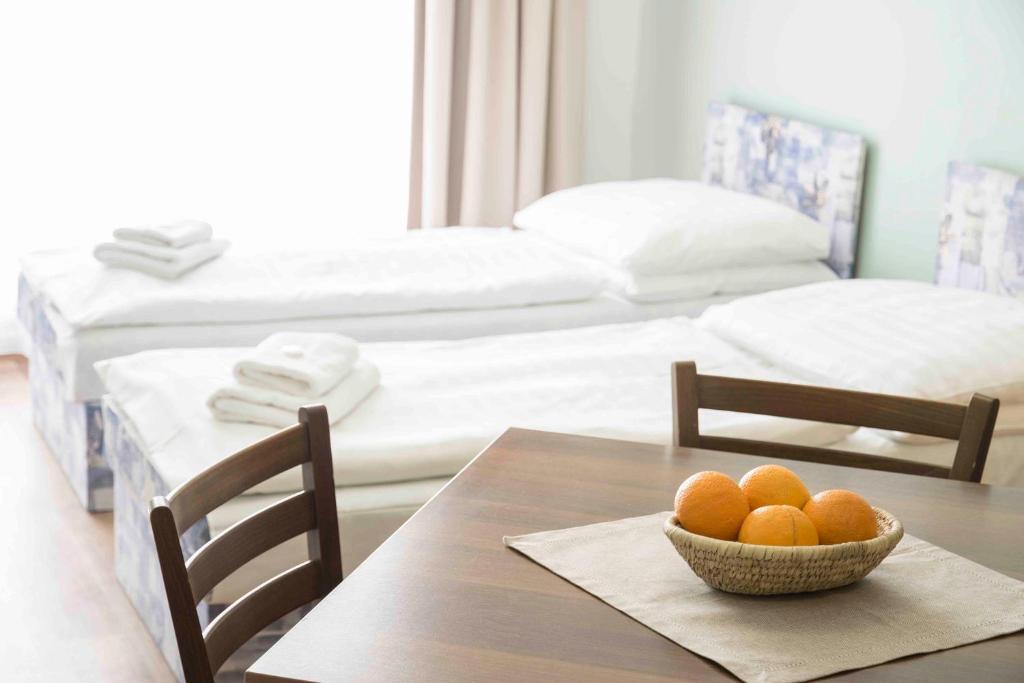 Postel nebo postele na pokoji v ubytování Studia a apartmány U Karla