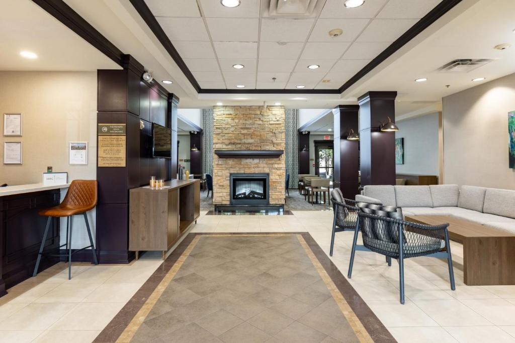 a lobby of a hospital with a fireplace at Staybridge Suites Guelph by IHG in Guelph