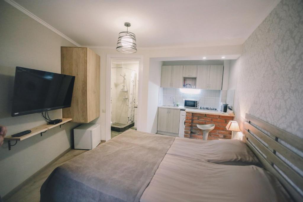 Televizorius ir (arba) pramogų centras apgyvendinimo įstaigoje Apartment Serpoint