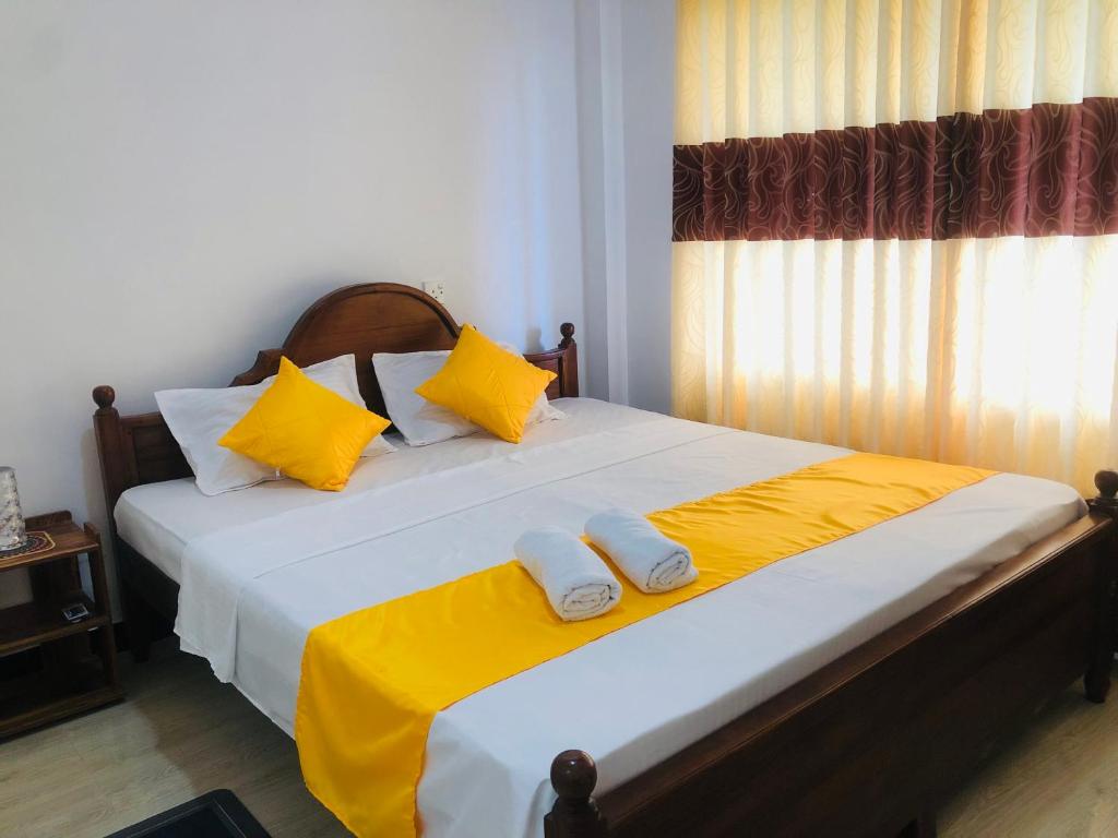 Ένα ή περισσότερα κρεβάτια σε δωμάτιο στο Grand Infinite Home Stay