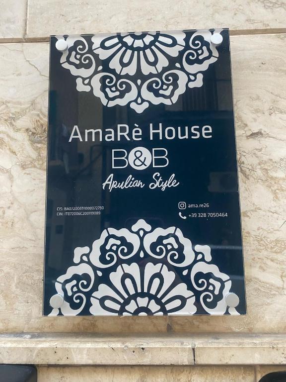 a sign for an american house kitchen style at AmaRé House in Bari